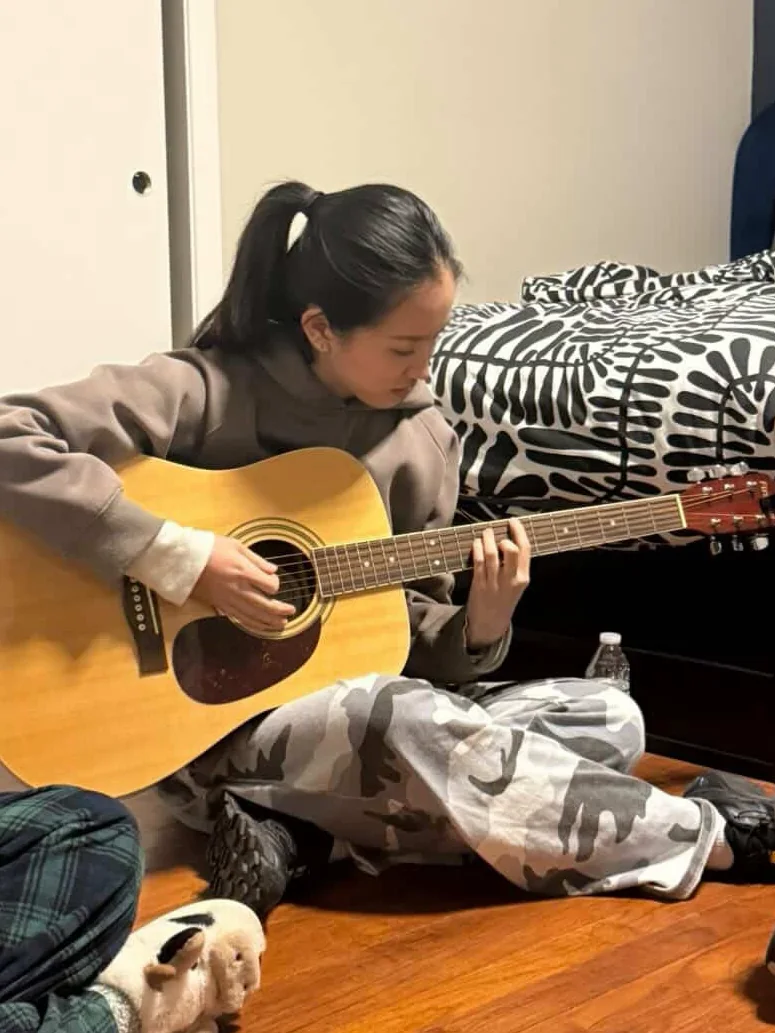 Ashley playing guitar
